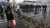 FILE - A road is blocked by protesters after authorities raised gasoline prices, in Tehran, Iran, Nov. 16, 2019.
