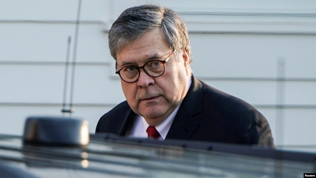 FILE - Attorney General William Barr leaves his house in McClean, Virginia, March 25, 2019.