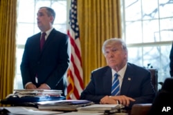 President Donald Trump listens as Intel CEO Brian Krzanich speaks in the Oval Office of the White House in Washington, Wednesday, Feb. 8, 2017.