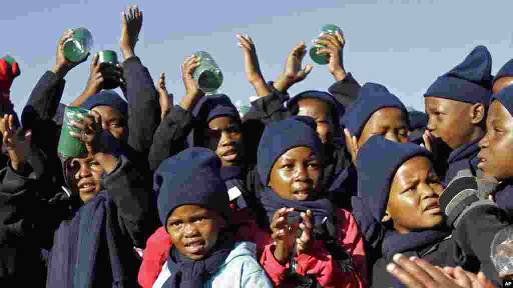 Children sing happy birthday in honor of former South African president Nelson Mandela during celebrations for Mandela's birthday in Mvezo, South Africa, July 18, 2012.