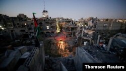  Una vista general de las casas dañadas que fueron destruidas por los ataques aéreos israelíes durante los combates Israel-Hamas en Gaza, 23 de mayo de 2021.