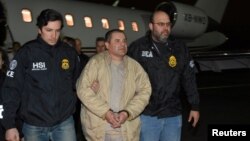 Mexico's top drug lord Joaquin "El Chapo" Guzman is escorted as he arrives at Long Island MacArthur airport in New York, U.S., Jan. 19, 2017, after his extradition from Mexico. 