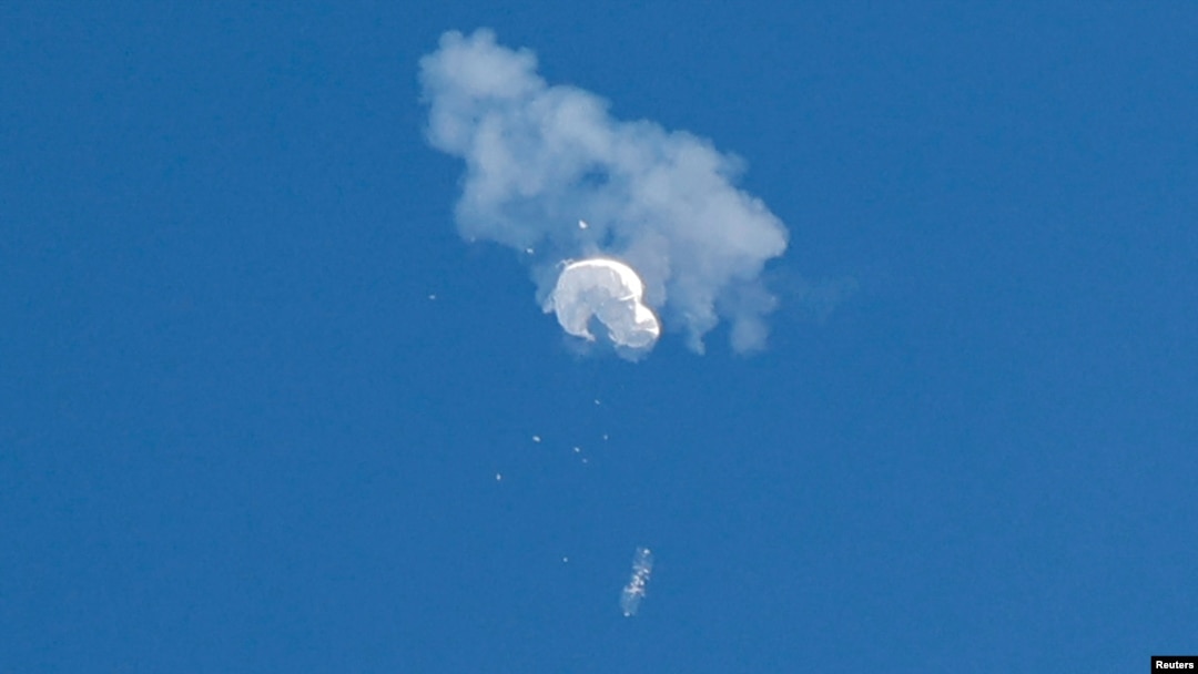 FILE - The suspected Chinese spy balloon drifts to the ocean after being shot down off the coast in Surfside Beach, South Carolina, U.S. February 4, 2023. (REUTERS/Randall Hill/File Photo)