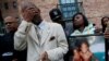 Mourners grieve at a vigil in honor of Edward and Edwin Bryant, twin brothers who at age 17 were shot and killed in Chicago, Illinois, Oct. 31, 2016. 