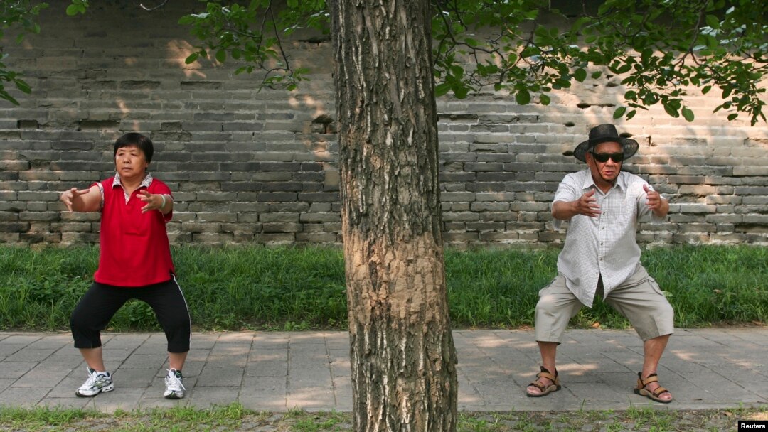 These people are doing a traditional form of Chinese exercise in a Beijing park, 2008. (Reuters/Grace Liang)
