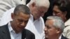 President Barack Obama, left, talks to Guatemala's President Otto Perez at the sixth Summit of the Americas in Cartagena, Colombia, Sunday April 15, 2012. 