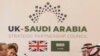 FILE - Saudi Crown Prince Mohammed bin Salman, 2nd right, conducts a meeting with then-Britain's Prime Minister Theresa May, 2nd left, with other members of their delegations, inside 10 Downing Street, London, March 7, 2018.