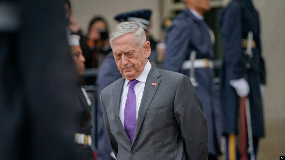 FILE - Defense Secretary Jim Mattis waits for Chinese Minister of Defense General Wei Fenghe to begin an arrival ceremony at the Pentagon, Nov. 9, 2018. 