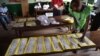 Election workers count votes after polls closed during the presidential and legislatives elections in Bangui's city center, Central African Republic, Dec. 30, 2015.