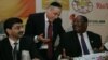 Reuven Kaufman President of the Diamond Dealers Club of New York (C) talks with Zimbabwean Minister of Mines and Mining Development Obert Mpofu (R) during the Zimbabwean Diamond Conference, Victoria Falls, November 13, 2012.