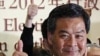 The next Hong Kong Chief Executive Leung Chun-ying celebrates as he attend a news conference at a vote counting station in Hong Kong, March 25, 2012. 