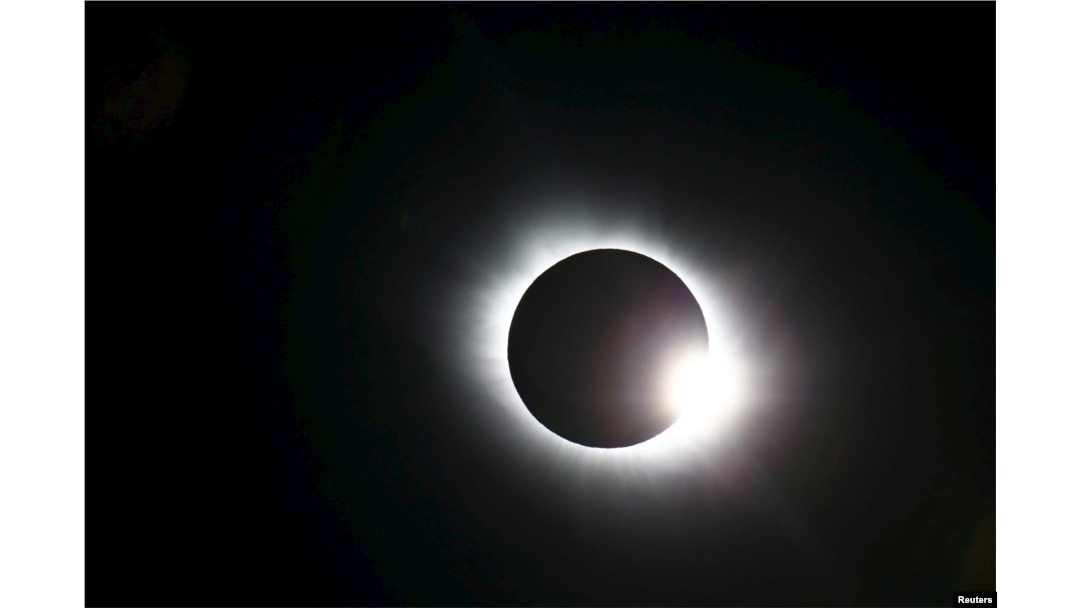 A total solar eclipse occurs over Svalbard in the Arctic Ocean, March 20, 2015.