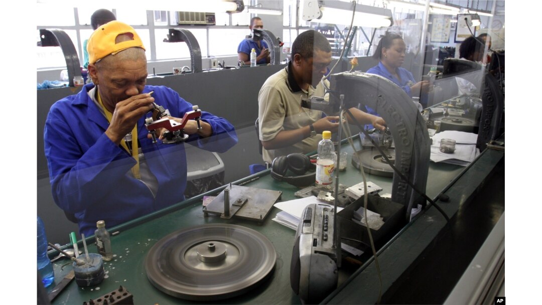 FILE - Diamonds are polished at the Krochmal and Cohen diamond factory in Johannesburg.