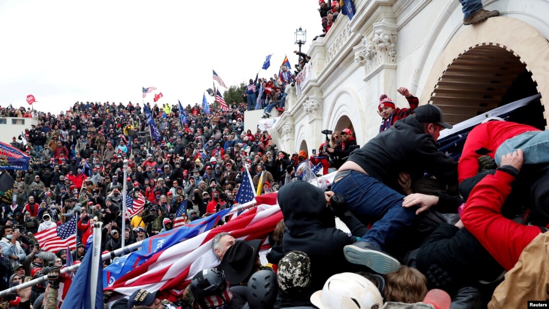 FILE - Pro-Trump protesters storm into the U.S. Capitol during a rally to contest the certification of the 2020 U.S. presidential election results by the U.S. Congress, in Washington, Jan. 6, 2021.