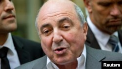 Russian oligarch Boris Berezovsky speaks to members of the media after losing his court battle against Roman Abramovich, at a division of the High Court in London August 31, 2012.