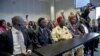 Plaintiffs Alali Efanga, Friday Alfrad Akpan, Chief Fidelis A. Oguru, Eric Dooh, and lawyer Chima Williams wait for the start of a court case against Shell, in The Hague, October 11, 2012.
