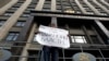 FILE - A lone activist protests restrictive law targeting foreign-funded NGOs working in Russia, outside the Duma, Russia's lower house of parliament, in Moscow.