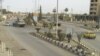 FILE - Syrian army tanks are seen in Deir al-Zour. 