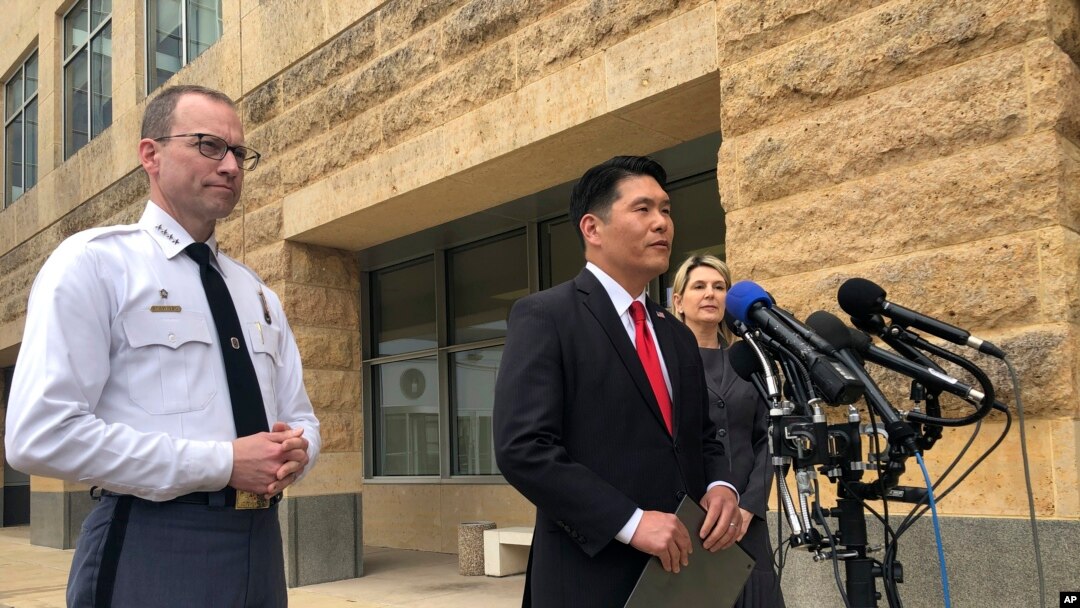 FILE - From left to right, Prince George’s County Police Chief Henry Stawinski, U.S. Attorney Robert Hur, of the District of Maryland, and Jennifer Moore, Baltimore special agent, address reporters April 9, 2019, outside the federal courthouse in Greenbelt, Mary