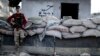 A fighter of Syrian opposition stands at a checkpoint in northwestern city of Idlib, Syria, Oct. 13, 2018. 