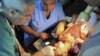 A child wounded by shelling is treated at a makeshift hospital at the Qusseer neighborhood of Homs, July 18, 2012.