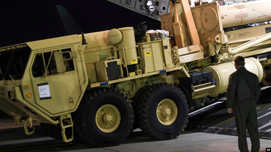 FILE - U.S. Forces Korea, a truck carrying parts of U.S. missile launchers needed to set up the Terminal High Altitude Area Defense (THAAD) missile defense system arrive at Osan air base in Pyeongtaek, South Korea.