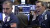Traders work on the floor of the New York Stock Exchange, Feb. 19, 2016.