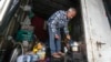 Nelson Antonio da Silva, who lost his home to flooding, shelters in a truck trailer in Canoas, Rio Grande do Sul state, Brazil, on May 10, 2024.