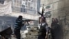 Free Syrian Army fighters fire at enemy positions during heavy clashes with government forces in the Salaheddine district of Aleppo, December 29. (AP)