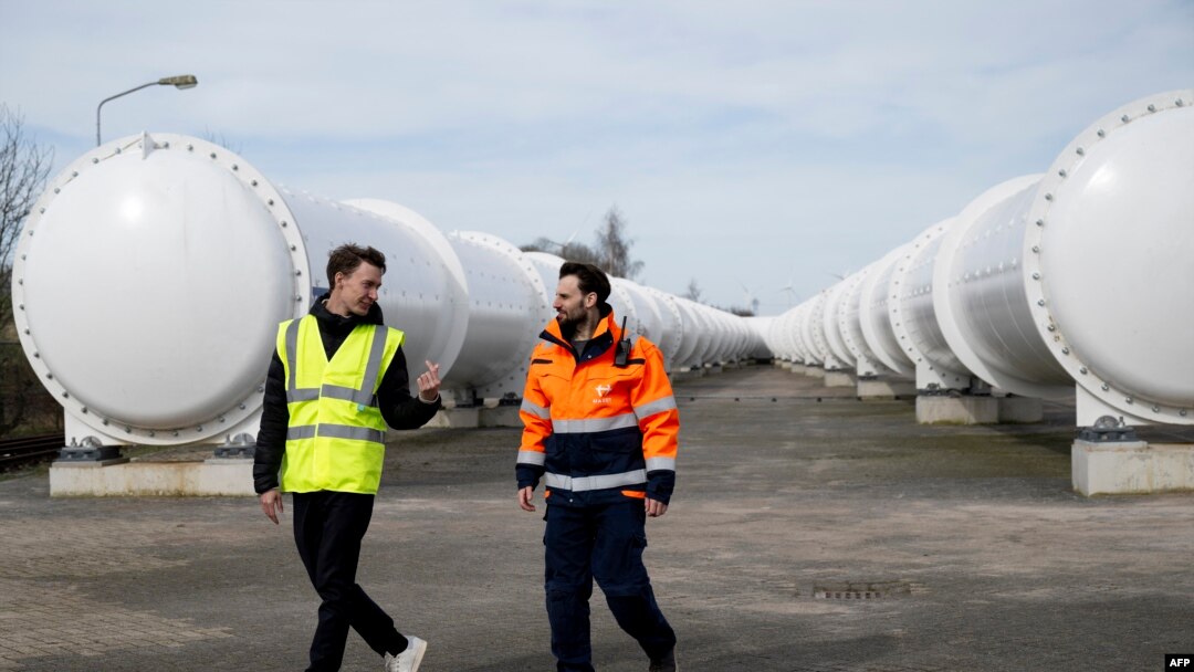 Sascha Lamme, left, and Marinus Van Der Meis walk at the European Hyperloop Center, with a 420m long tunnel serving as a testing facility, on March 26, 2024.