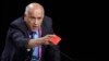 Palestinian football chief Jibril Rajoub shows a red card as he speaks during a FIFA Congress in Zurich, Switzerland, May 29, 2015.