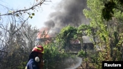 Wildfire burns in Varnava, near Athens