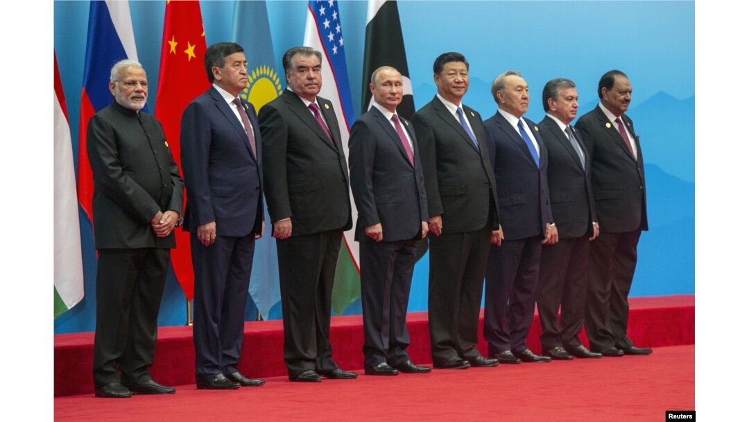Russian President Vladimir Putin is seen during a photo session of the SCO (Shanghai Cooperation Organisation) Heads of State ahead of a meeting of the SCO Council of Heads of State in Qingdao, China, June 10, 2018.