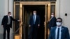 FILE - President Donald Trump walks out of Walter Reed National Military Medical Center after receiving treatment as a COVID-19 patient, in Bethesda, Maryland, Oct. 5, 2020.