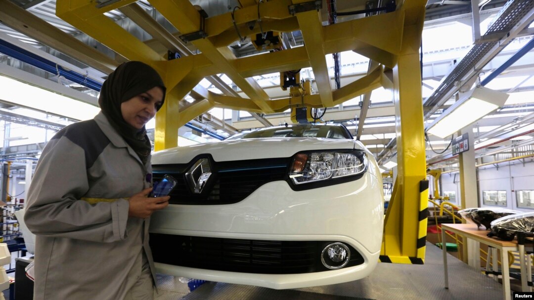 FILE - A female employee works in a Renault factory in Oran, west of Algiers.