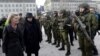 FILE - German Defense Minister Ursula von der Leyen, left, and Lithuania's President Dalia Grybauskaite attend a ceremony to welcome the German battalion being deployed to Lithuania as part of NATO deterrence measures against Russia in Rukla, Lithuania, F