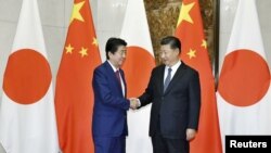 中国国家主席习近平在北京会晤到访的日本首相安倍晋三。（2018年10月26日）