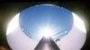 An Air Force An LGM-118A Peacekeeper intercontinental ballistic missile points skyward from its position in a silo