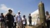 Activists and international delegations look at cluster bomb units during a visit to a Lebanese military base, Nabatiyeh, Lebanon, September 11, 2011.