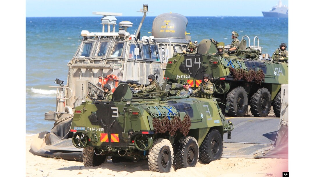 Soldiers sit atop of amphibious vehicles as NATO troops participate in the NATO sea exercises BALTOPS 2015 that are to reassure the Baltic Sea region allies in the face of a resurgent Russia, in Ustka, Poland, June 17, 2015.