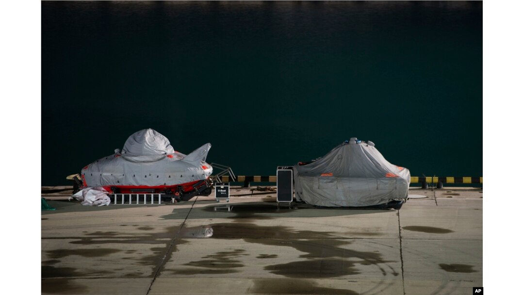 Two submersibles stand ready to join the search for bodies and fragments of the crashed plane, on a pier just outside Sochi, Russia, Dec. 26, 2016.