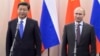 FILE - Russia's President Vladimir Putin (R) is seen with his Chinese counterpart Xi Jinping in Sochi, Russia, February 6, 2014.