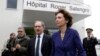 French Social Affairs and Health Minister Marisol Touraine (front) leaves Roger Salengro hospital where the patient with confirmed case of the SARS-like coronavirus is being treated, in Lille, France, May 11, 2013.