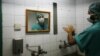 FILE - A Palestinian doctor washes his hands prior to performing surgery at a hospital in Gaza City