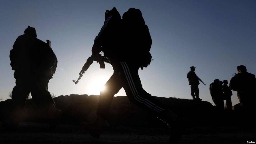 Afghan security forces arrive at the site of truck blast in Kabul, Afghanistan, Nov. 18, 2014.