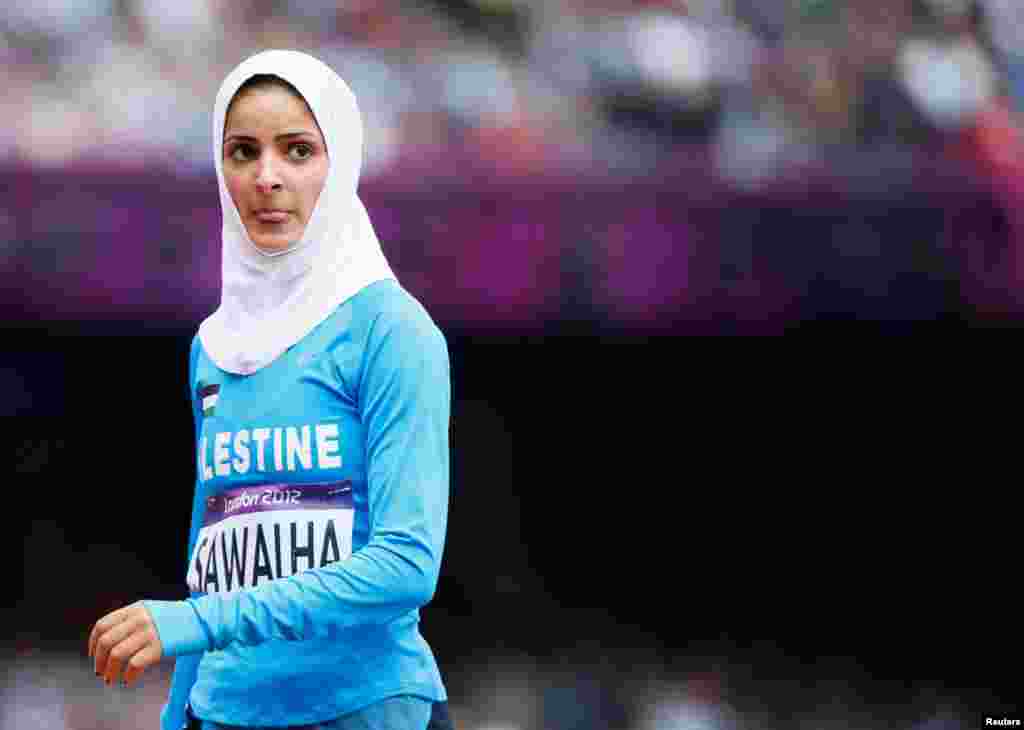 Woroud Sawalha stands after competing in the women's 800m round 1 heat. She did not qualify.