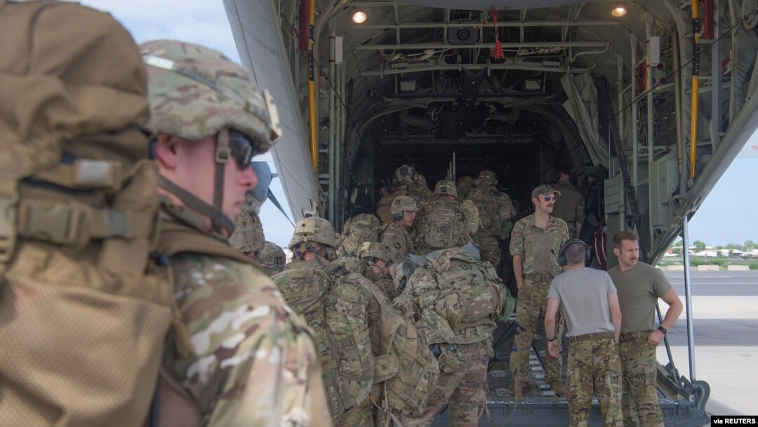 FILE - U.S. Army soldiers beginning a mission to bolster the security of Manda Bay Airfield, Kenya, after an attack by Somalia's al Shabab militants, board a transport plane in Camp Lemonnier, Djibouti, Jan.5, 2020. 