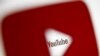 FILE - A 3-D-printed YouTube icon is seen in front of a displayed YouTube logo in this illustration taken Oct. 25, 2017. 