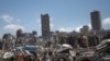 FILE - Damaged cars remain at the site of the Aug. 4 deadly blast in the port of Beirut that killed scores and wounded thousands, in Beirut, Lebanon, Aug. 17, 2020.