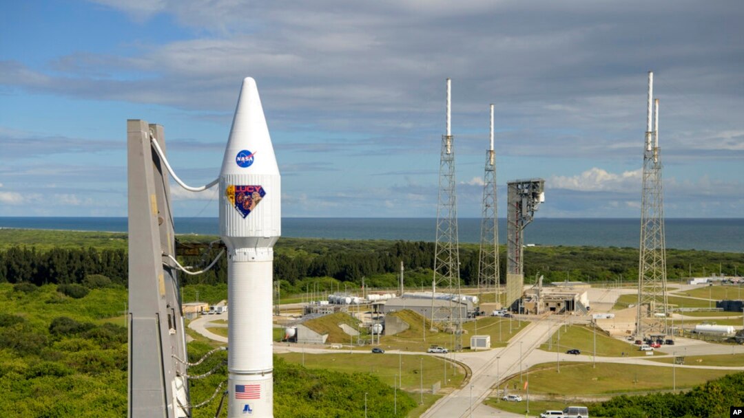 In this image released by NASA, a United Launch Alliance Atlas V rocket with the Lucy spacecraft aboard is rolled out of the Vertical Integration Facility to the launch pad at Space Launch Complex 41, in Cape Canaveral, Fla., Oct. 14, 2021. 